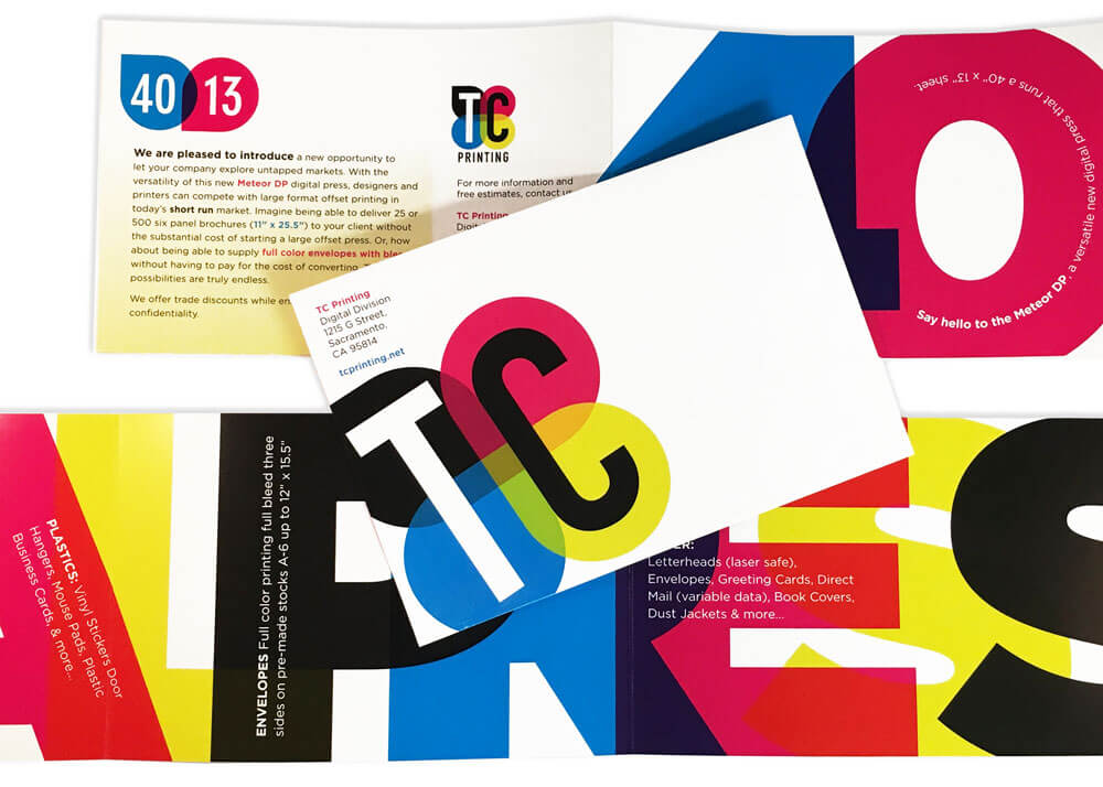 Folding mailer featuring large bold letters in cyan, magenta, yellow, and black.